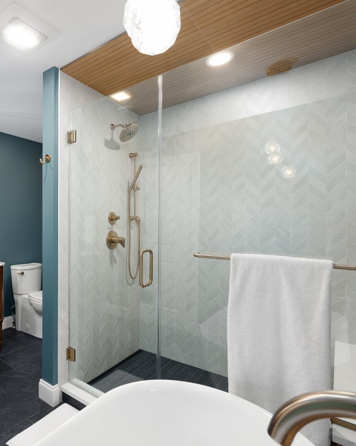 Custom Glass Shower with Chevron Tile & Brass Hardware